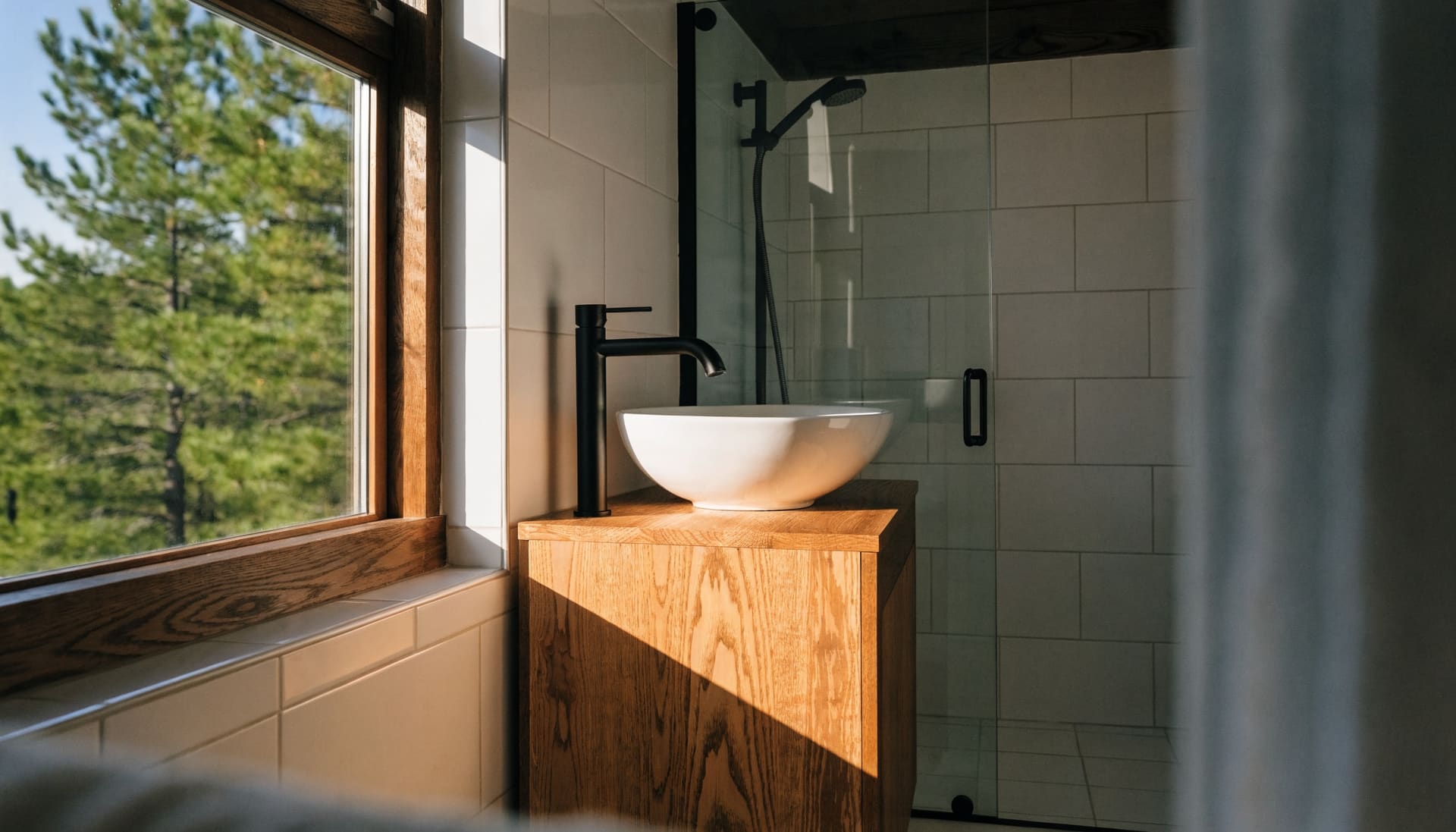A bright renovated bathroom with a wood vanity (representative image)