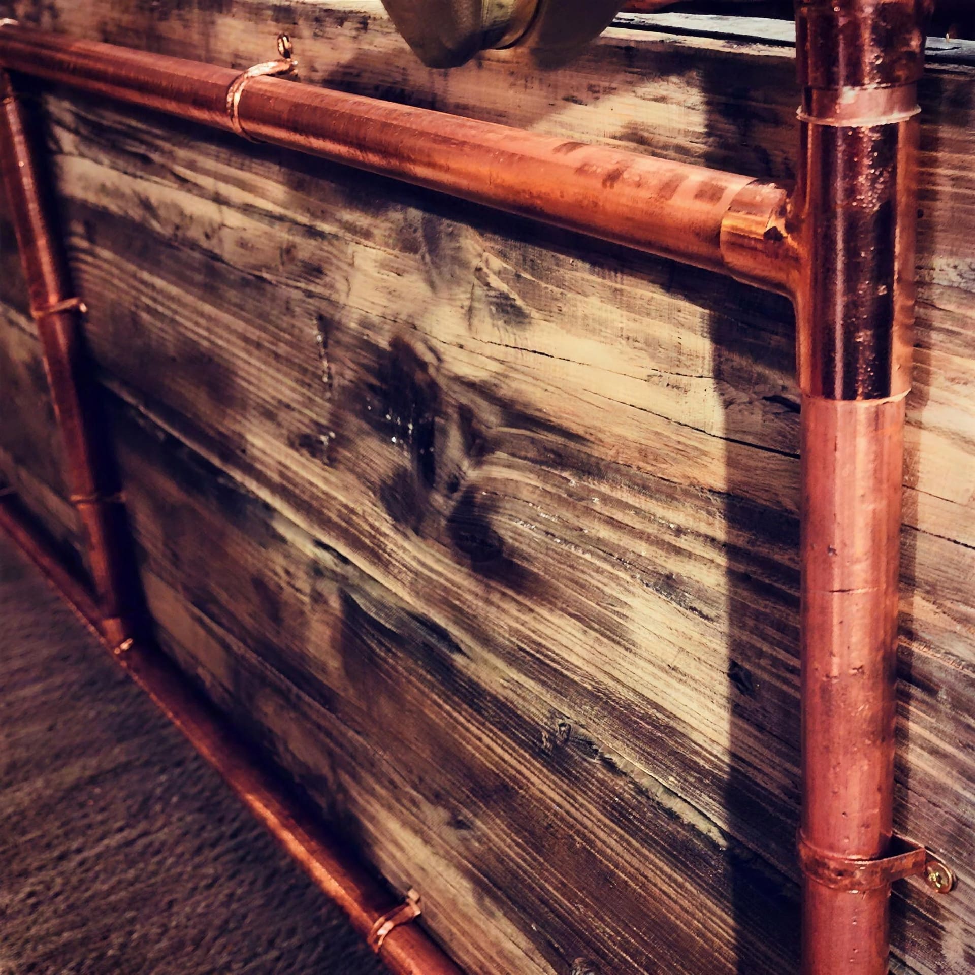 Custom furniture in reclaimed copper and pine by The Laughing Heart Plumbing Company